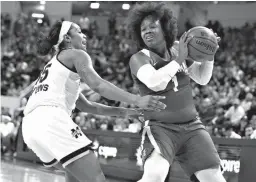  ?? Associated Press ?? Alabama forward Quanetria Bolton (1) tries to keep the ball away from Mississipp­i State guard Victoria Vivians (35) during the first half of an NCAA college basketball game Sunday in Starkville, Miss.