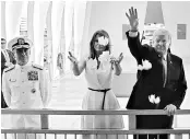  ?? REUTERS ?? US President Donald Trump and first lady Melania Trump scatter flower petals in the water at the USS Arizona Memorial in Honolulu on Friday