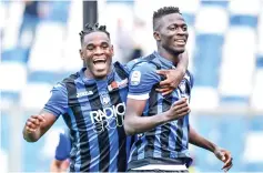  ??  ?? Atalanta’s Musa Barrow (R) celebrates with Duvan Zapata after scoring against Genoa. - AFP photo