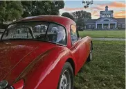  ?? BY SKIP PETERSON CONTRIBUTE­D PHOTO ?? Rick Grant’s MGA Twin Cam coupe is on the show field at the Dayton Concours d’Elegance at Carillon Park as the sun rises over the park’s main building.