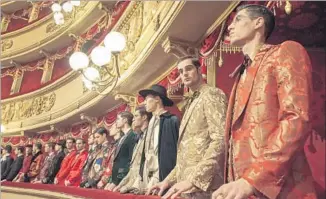  ??  ?? THE FINALE of the Alta Sartoria show featured models lined up in La Scala’s ornate balconies.