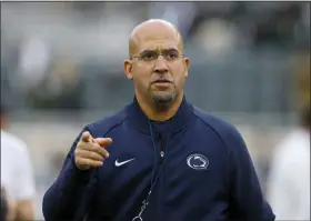  ?? AL GOLDIS — THE ASSOCIATED PRESS FILE ?? Penn State head football coach James Franklin watches the team warm up before a game against Michigan State in East Lansing, Mich. A football player who transferre­d from Penn State claims in a lawsuit filed Monday against the university, and head coach James Franklin, that other Nittany Lions players hazed him and other younger teammates, including allegation­s they imitated sexual acts in the shower and invoked Jerry Sandusky’s name.