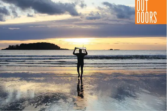  ?? DAWN PENNER ?? Andrew Penner faces down the ocean at Tofino, where he got an invigorati­ng taste for winter surfing, and was “one with the sea.”