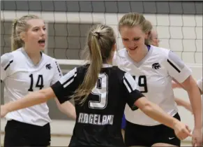  ?? Scott Herpst ?? Koda O’dell, Madison Lennon and Cece Davenport celebrate following a point during a match last year. All three will return to the roster for the Lady Panthers this season.