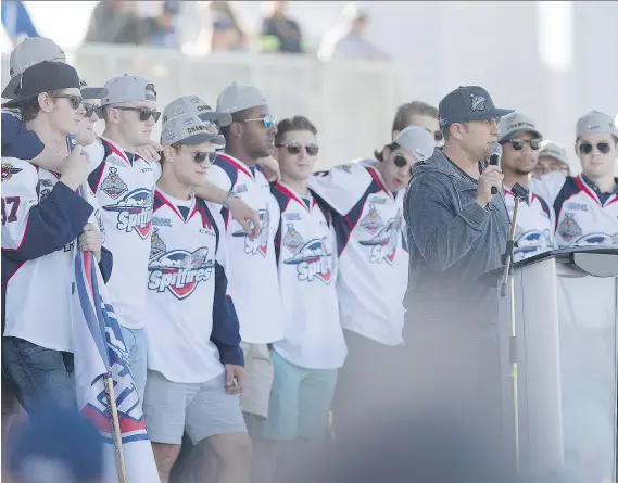  ?? PHOTOS: DAX MELMER ?? Team president Bob Boughner and the Windsor Spitfires stand onstage at the Riverfront Festival Plaza at the conclusion of Wednesday’s parade.