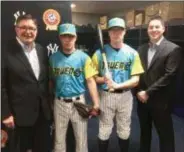  ?? KYLE FRANKO — TRENTONIAN PHOTO ?? Mercer County Executive Director Brian Hughes, left, and Thunder General Manager Jeff Hurley, right, pose with Thunder front offices employees Bryan Rock, center left, and Jon Bodnar, center right, to model the team’s Trenton Trueno uniforms it will wear in June.