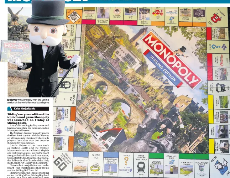  ??  ?? A player Mr Monopoly with the Stirling version of the world-famous board game