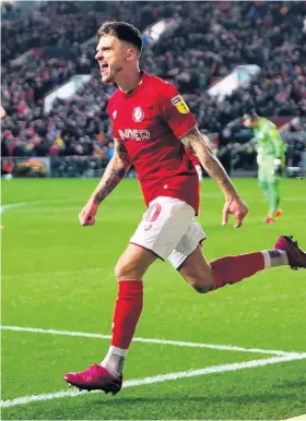  ??  ?? Jamie Paterson celebrates his first-minute goal for Bristol City