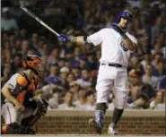  ?? NAM Y. HUH — ASSOCIATED PRESS ?? Cubs’ Kyle Schwarber, right, reacts after striking out swinging against the Giants during the third inning of Sunday night’s game at Wrigley Field in Chicago.