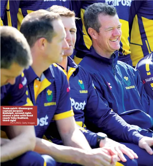  ?? PICTURES: Getty Images ?? Team spirit: Glamorgan captain Jacques Rudolph, second right, shares a joke with head coach Toby Radford, third right