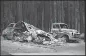  ?? SARA NEVIS/THE SACRAMENTO BEE ?? Vehicles burned by the Caldor Fire sit in Grizzly Flats on Tuesday.