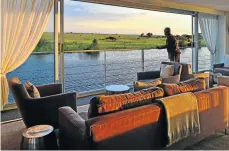  ?? Pictures: Izak van Zyl and supplied by The Mantis Collection ?? CRUISING WITH PACHYDERMS Left, a launch allows visitors to get close to a herd of elephants. Above left, the lounge on the Zambezi Queen and, right, a luxury bedroom facing the river.