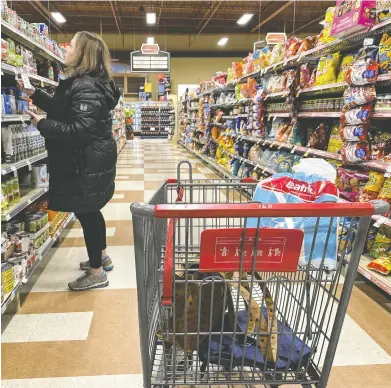  ?? CHRISTINNE MUSCHI / THE CANADIAN PRESS ?? Without all major players on board, the voluntary Canadian grocery code won't work, advocates and politician­s say.