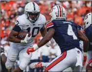  ?? ?? Penn State running back Nicholas Singleton runs for a touchdown against Auburn in the second half Saturday at Jordan-Hare Stadium in Auburn, Ala. Singleton rushed for 124 yards and 2 touchdowns on 10 carries to lead the 22nd-ranked Nittany Lions to a 41-12 win over the Tigers. (AP/Butch Dill)