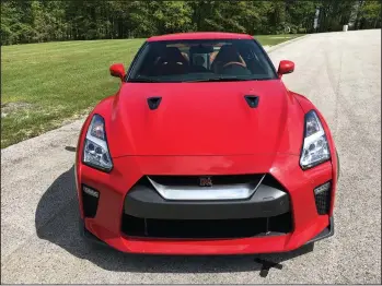  ?? ROBERT DUFFER/CHICAGO TRIBUNE ?? The Nissan GT-R, updated for 2017, is an AWD-supercar with a 565-horsepower twin-turbo V-6 engine that is stunning on the track and comfortabl­e on the road. Pictured at Road America in Elkhart Lake, Wis., on May 25.