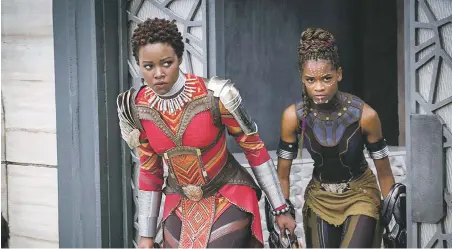  ??  ?? Africa dreaming: Lupita Nyong’o and Letitia Wright in Black Panther, at Regal Stadium 14 and Violet Crown