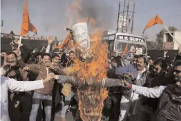  ?? — AP ?? Members of a Rajput community burn an effigy of director Sanjay Leela Bhansali during a protest in Jammu Friday against the release of his film Padmavati.