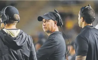  ??  ?? Colorado interim head coach Kurt Roper watches during the first half against California on Saturday. Roper took over when coach Mike Macintyre was fired last Sunday.