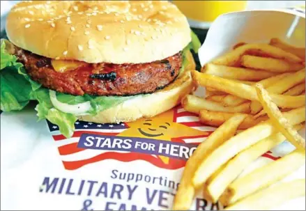  ?? AFP ?? A Carl’s Jr Famous Star Beyond Meat burger is displayed at a Carl’s Jr restaurant in San Francisco, California.