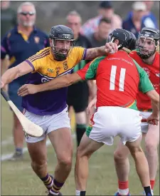  ??  ?? David Mooney (Faythe Harriers) trying to shake off Tomás Mahon (Rapparees) in the Pettitt’s SHC clash in New Ross on Saturday.