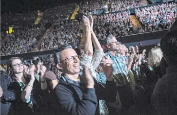  ?? Photograph­s by Michael Owen Baker For The Times ?? IT’S STANDING-O TIME for Neil Diamond as fans show their appreciati­on Saturday night at the Forum.