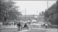  ?? The Associated Press ?? TIBBETTS’ FUNERAL: People leave Mollie Tibbetts’ funeral at Brooklyn-Guernsey-Malcom High School, Sunday, in Brooklyn, Iowa. Cristhian Bahena Rivera is charged with first-degree murder in Tibbetts’ death. Authoritie­s have said Tibbetts was abducted while running in July, and an autopsy showed that she died from stab wounds.