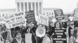  ?? JOSE LUIS MAGANA/AP ?? Demonstrat­ors protest outside the Supreme Court in Washington on Tuesday.