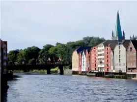  ??  ?? Above: Wooden storehouse­s dating from the 18th century on both banks of the River Nidelva in Trondheim, looking towards the Old Town Bridge, with the spire of the cathedral beyond.