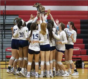  ?? TIMOTHY ARRICK — FOR MEDIANEWS GROUP ?? The Royal Oak Shrine volleyball team celebrates with their hardware after defeating Lutheran Northwest 3-1 in a Division 3 Regional Final on Thursday at Lutheran Northwest High School in Rochester Hills.