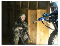  ?? AP PHOTO BY JOHN BAZEMORE ?? In this Oct. 4 photo, U.S. Army recruit Kirsten practices building clearing tactics with male recruits at Ft. Benning, Ga. She is one of a handful of women training to become infantry soldiers.