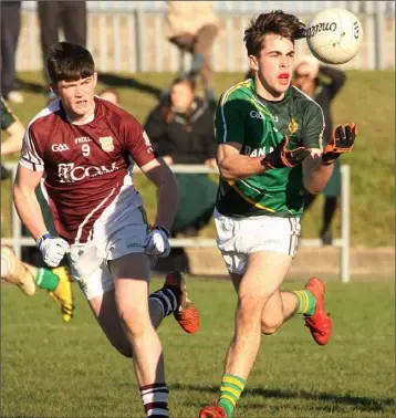  ??  ?? Eoghan Herlihy has possession for Enniscorth­y C.B.S. as Cillian Redmond exerts heavy pressure.