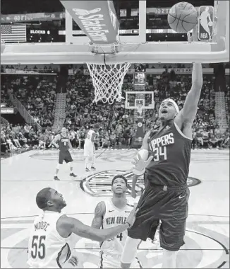  ?? Photograph­s by Gerald Herbert Associated Press ?? TOBIAS HARRIS scored a team-high 26 points for the Clippers, who couldn’t overcome 16 turnovers and poor three-point shooting at New Orleans in losing their first road game of the season.