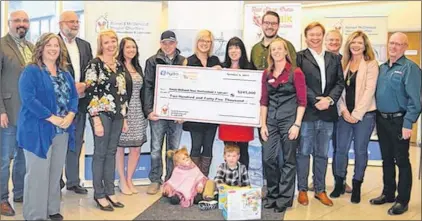  ?? SUBMITTED PHOTO ?? (From left) Aiden Hibbs and Gina Pinsent (Steele Communicat­ions), Jim Haynes (NL Hydro) Annette Higdon (Nlhydro), Janine Browne (PAL Airlines), Toms Family (Jake, Nikita, Peyton & Liam), Christine Morgan (RMHC NL), Stephen Patten (St. John’s Red Shoe...