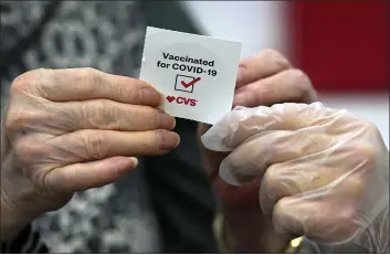  ?? MARCIO JOSE SANCHEZ — THE ASSOCIATED PRESS FILE ?? A patient receives a sticker after receiving a shot of the Moderna COVID-19at a CVS Pharmacy branch in Los Angeles on March 1.