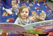  ?? FILE PHOTO ?? For more than 28 years, Reach Out and Read has worked to help all children enter school on a level playing field by engaging parents to read more often with their infants, toddlers and preschoole­rs.