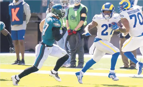  ?? CHRIS SZAGOLA/AP ?? Being out of position was the default setting of linebacker Nate Gerry, left, and the entire Eagles defense against the Los Angeles Rams on Sunday.