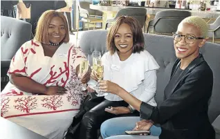  ??  ?? Yoliswa Mgoco, Thobeka Mgoco and Twiggy Moli enjoy a bubbly aperitif before the Nederburg tasting luncheon at Marble Restaurant.