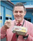  ?? PHOTO: SELINA POWELL/FAIRFAX NZ ?? Nelson Marlboroug­h District Health Board chief executive Chris Fleming tries a Meals on Wheels dish. The meals will be served in microwavab­le plastic containers by the time a new meals system is rolled out.