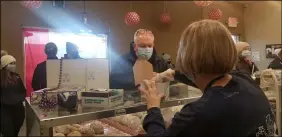  ?? JORDANA JOY — THE MORNING JOURNAL ?? Kiedrowski’s Simply Delicious Bakery, 2267Cooper Foster Park Road in Amherst, fills orders on Fat Tuesday, despite inclement weather conditions.