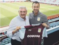  ??  ?? John Terry with Villa boss Steve Bruce.