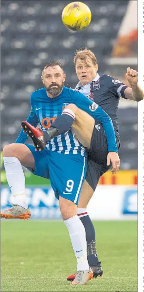  ??  ?? SOMETHING LEFT IN THE TANK: Kris Boyd, pictured tangling with Ross County’s Jay McEveley, scored the fastest goal in Premiershi­p history as Kilmarnock ended a winless run that had stretched to seven matches prior to Saturday’s result.