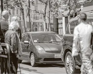  ?? Nicole Boliaux / San Francisco Chronicle ?? An Uber driver steers through San Francisco. Recommenda­tions for Uber’s culture are coming Tuesday.