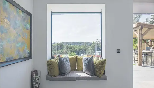  ?? ?? Create a cosy nook with cushions and pillows (photo: Express Bi-Folding Doors)