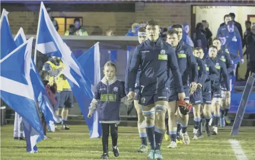  ??  ?? 0 Connor Boyle leads Scotland Under-20s out for a Six Nations clash at Netherdale and he’ll captain the side again at the World Cup.