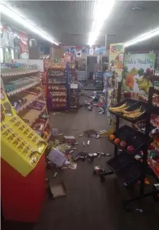  ?? AP ?? A WHOLE LOT OF SHAKING GOING ON: Various items litter the floor of the 4 Brothers Store in Sparta, N.C. after an earthquake shook much of North Carolina early Sunday.