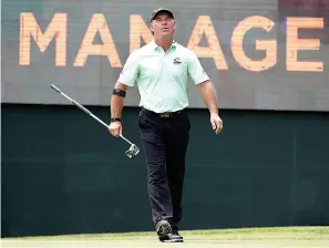  ?? AP Photo/Charlie Neibergall ?? ■ In this May 31, 2019, file photo Scott McCarron reacts after missing a putt on the 17th green during the first round of the PGA Tour Champions Principal Charity Classic golf tournament in Des Moines, Iowa. McCarron won the Charles Schwab Cup on Sunday in Phoenix while waiting in the clubhouse.