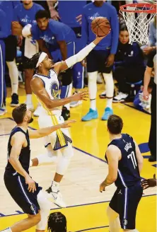  ?? Santiago Mejia / The Chronicle ?? Rookie Moses Moody contribute­d to the Warriors’ Game 2 win over the Mavericks with a plus-8 rating in 91⁄2 minutes of play.