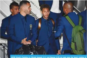  ??  ?? SOCHI: Brazil’s Paulinho (L), Renato Augusto (2-L) and Neymar (2-R) are seen upon the team’s landing at Sochi airport, in Russia yesterday, ahead of the FIFA World Cup. — AFP