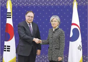  ?? LEE JIN-MAN/ASSOCIATED PRESS ?? South Korean Foreign Minister Kang Kyung-wha, right, and Timothy Betts, acting deputy assistant secretary and senior advisor for security negotiatio­ns and agreements in the U.S. Department of State, shake hands for the media before their meeting at Foreign Ministry in Seoul, South Korea.