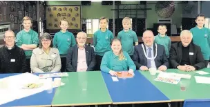  ??  ?? Bollington mayor and councillor­s with pupils